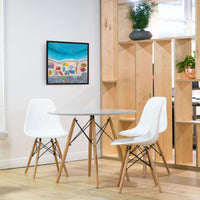A colorful print of Day at the Beach by Artglober hangs in a modern kitchen.