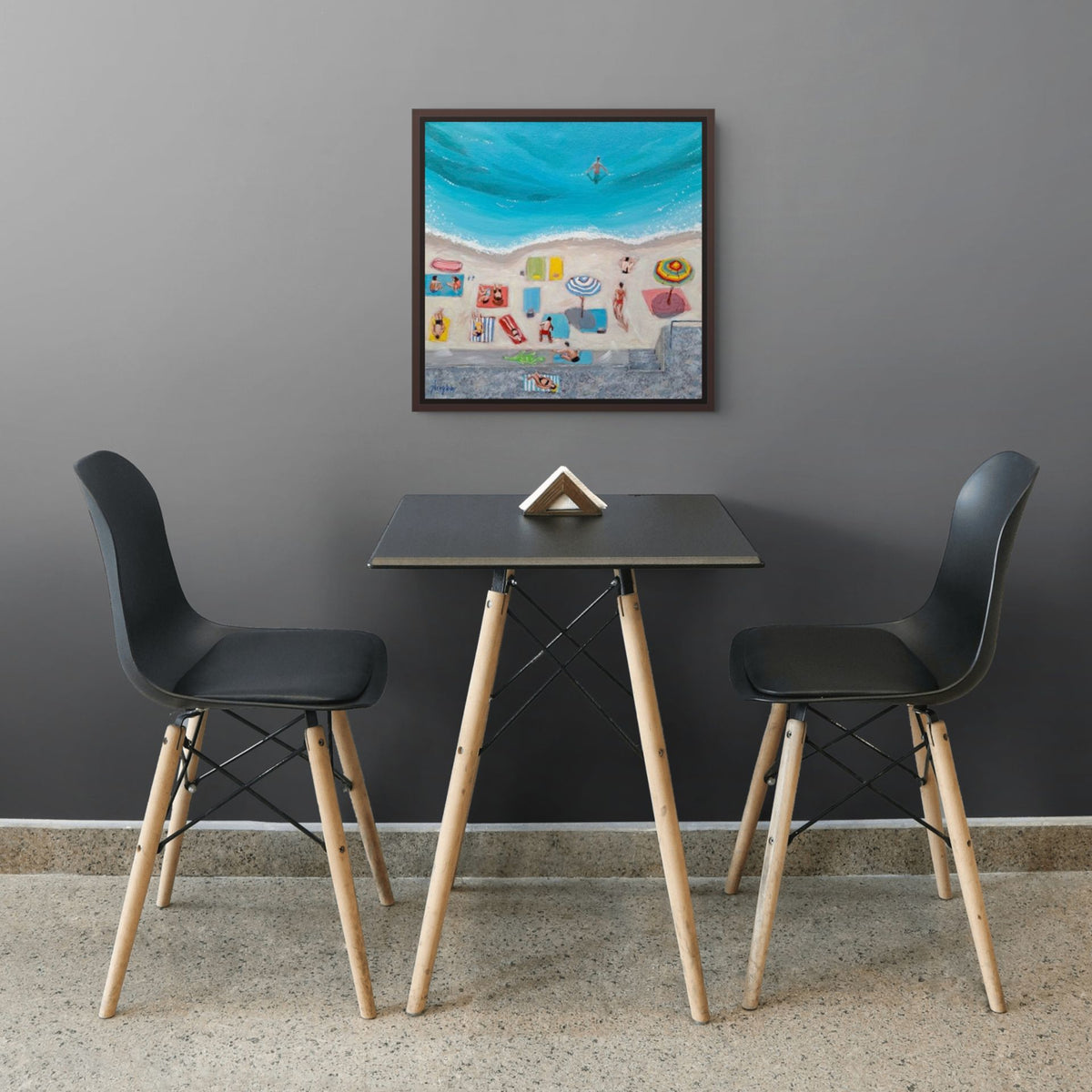 A colorful beach-themed print of Day at the Beach by Artglober in a grey kitchen.