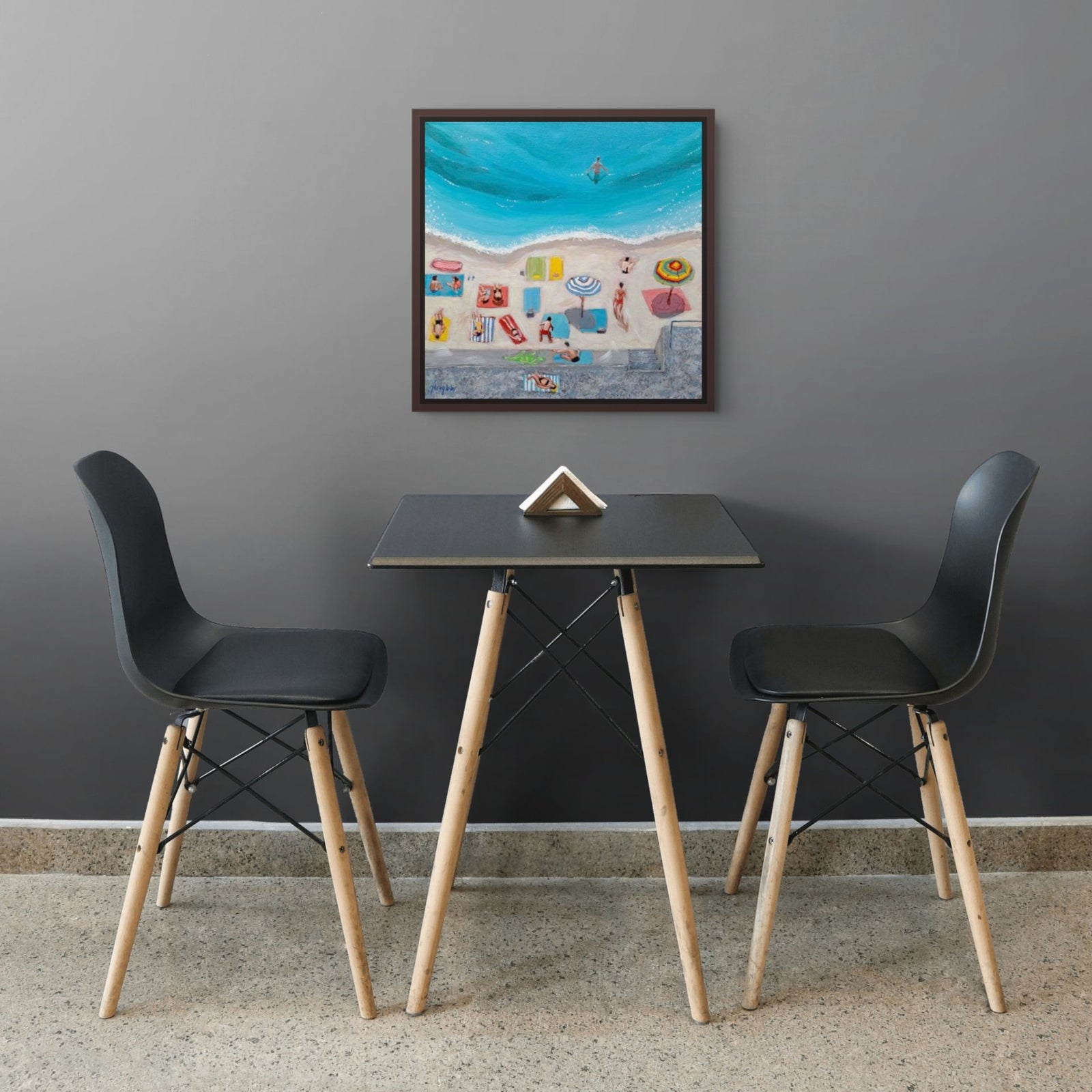 A colorful beach-themed print of Day at the Beach by Artglober in a grey kitchen.