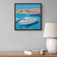 Framed Canvas Wall art print of, "The Mightiest Little Fishing Boat" by Artglober hangs above a desk.